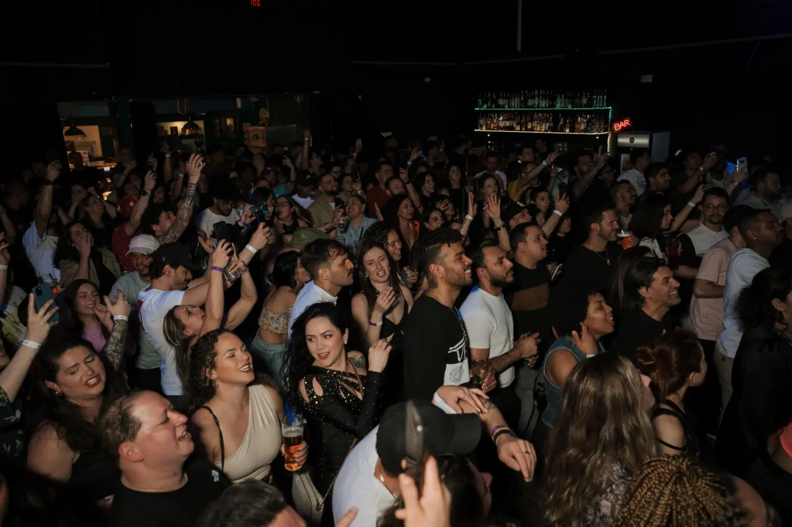 Crowd singing along during a live show at Kino Events House