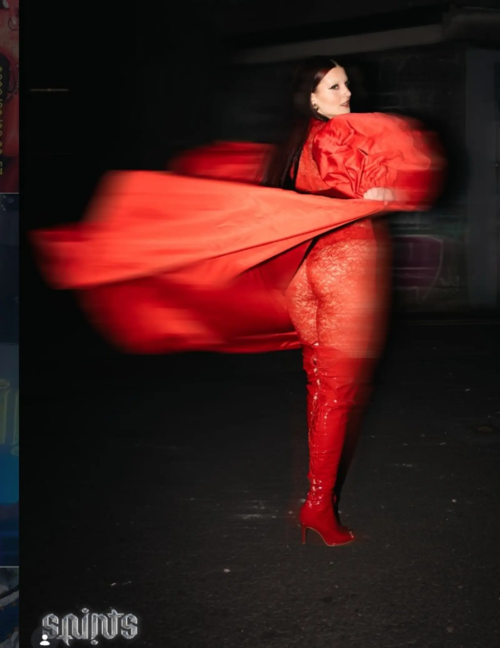 Drag performer in a red look mid-performance at Kino Events House