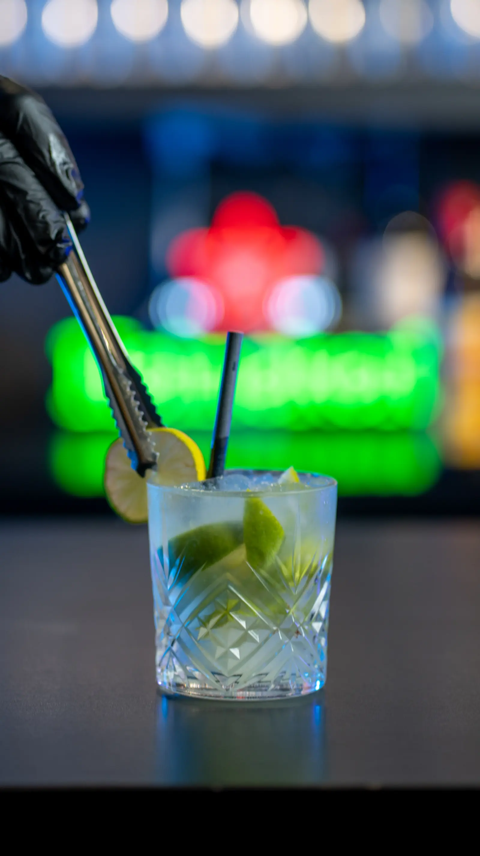 Signature cocktail being finished at the bar