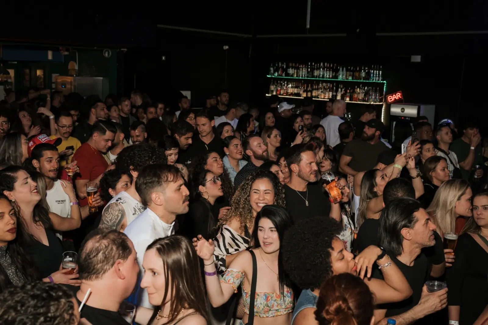 Packed crowd at the bar during a live show