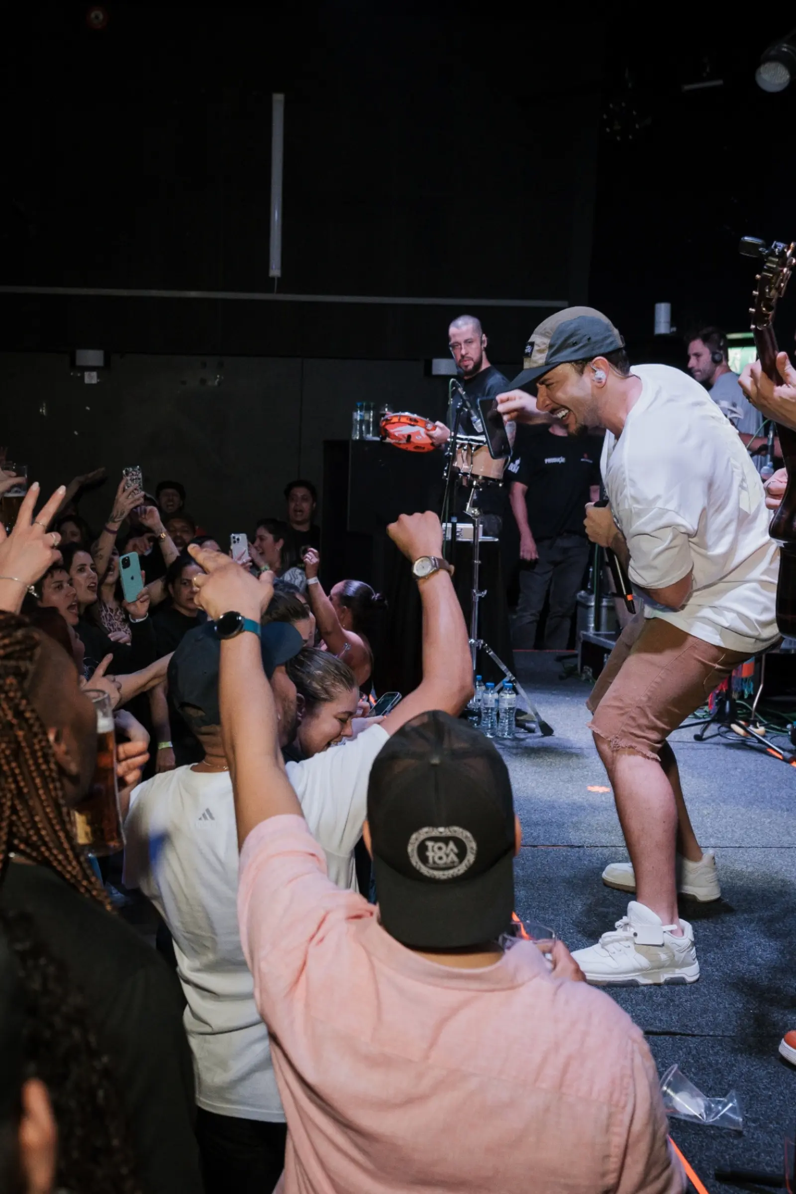 Singer at the edge of the stage at Kino Events House