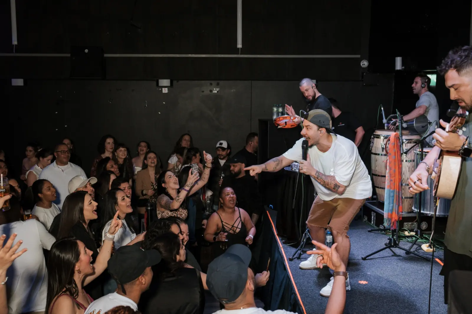 Artist performing on stage at Kino Events House
